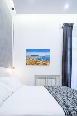 Letto o letti in una camera di Casa Nora Napoli