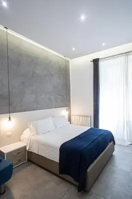 Letto o letti in una camera di Casa Nora Napoli