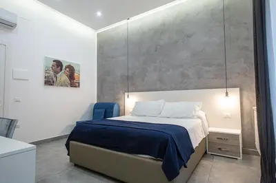 Letto o letti in una camera di Casa Nora Napoli