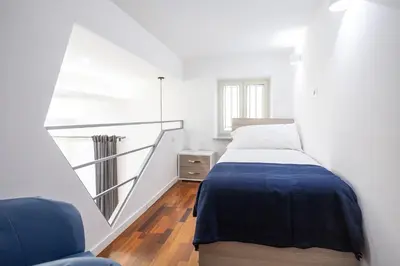 Letto o letti in una camera di Casa Nora Napoli