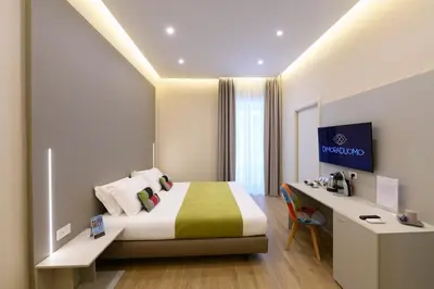 Letto o letti in una camera di DIMORA DUOMO