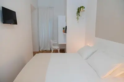 Letto o letti in una camera di Interno21