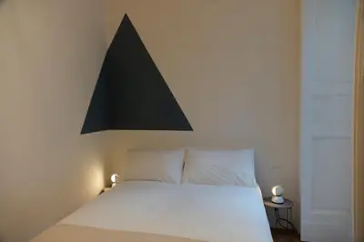 Letto o letti in una camera di Interno21