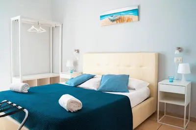 Letto o letti in una camera di Vico 22 Rooms Napoli