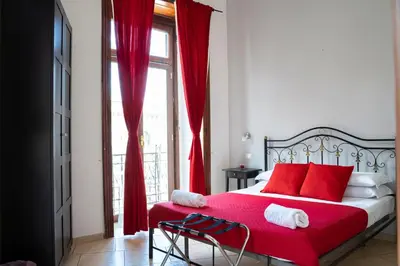 Letto o letti in una camera di Vico 22 Rooms Napoli