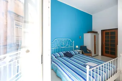 Letto o letti in una camera di Camera Con Vista Apartments