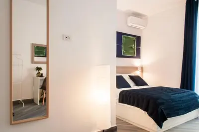 Letto o letti in una camera di Demi Rooms
