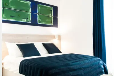Letto o letti in una camera di Demi Rooms