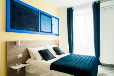 Letto o letti in una camera di Demi Rooms