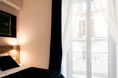 Letto o letti in una camera di Demi Rooms