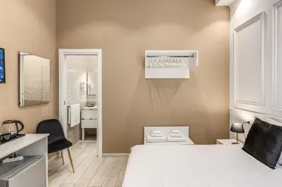 Letto o letti in una camera di RAGGIO DI SOLE - ATAROOMS Collection