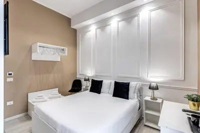 Letto o letti in una camera di RAGGIO DI SOLE - ATAROOMS Collection
