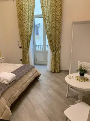 Letto o letti in una camera di B&B Le Stanze di Santa Chiara