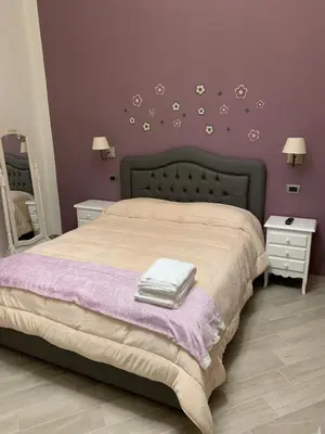 Letto o letti in una camera di B&B Le Stanze di Santa Chiara