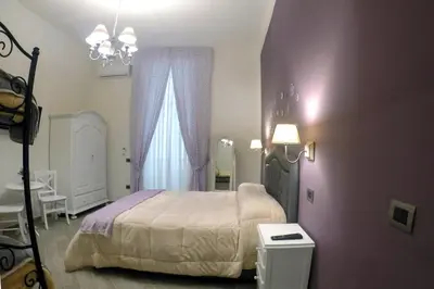 Letto o letti in una camera di B&B Le Stanze di Santa Chiara