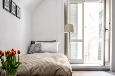 Letto o letti in una camera di Manuela Apartments Piazza del Plebiscito Centro