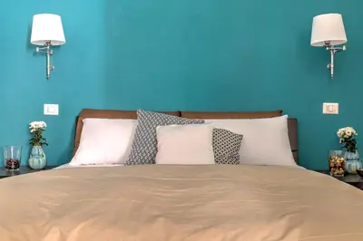 Letto o letti in una camera di Manuela Apartments Piazza del Plebiscito Centro