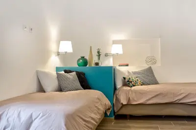 Letto o letti in una camera di Manuela Apartments Piazza del Plebiscito Centro