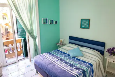 Letto o letti in una camera di Viaggio a Napoli B&B