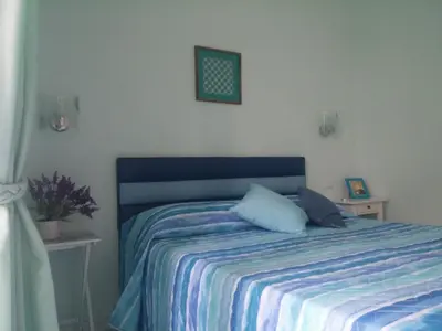 Letto o letti in una camera di Viaggio a Napoli B&B