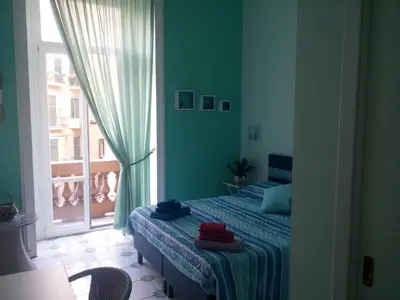 Letto o letti in una camera di Viaggio a Napoli B&B