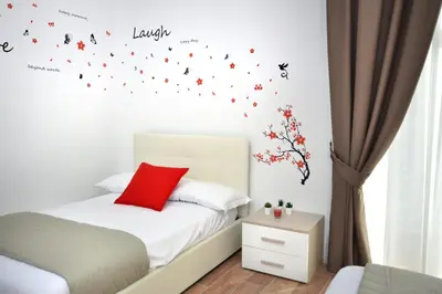Letto o letti in una camera di B&BCentral Station Napoli