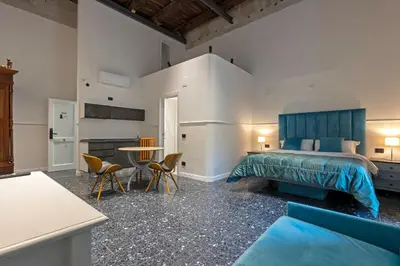Letto o letti in una camera di Il Tesoro Smart Suite & SPA