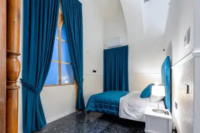 Letto o letti in una camera di Il Tesoro Smart Suite & SPA
