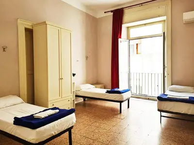 Letto o letti in una camera di 6 Small rooms