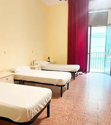 Letto o letti in una camera di 6 Small rooms