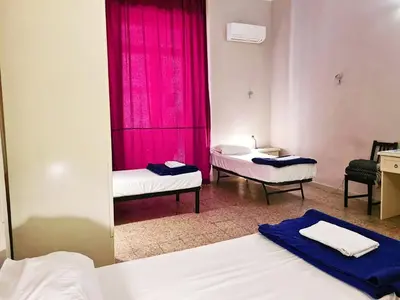 Letto o letti in una camera di 6 Small rooms