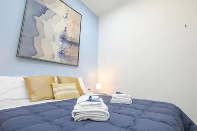 Letto o letti in una camera di Il vicoletto di Santa Lucia