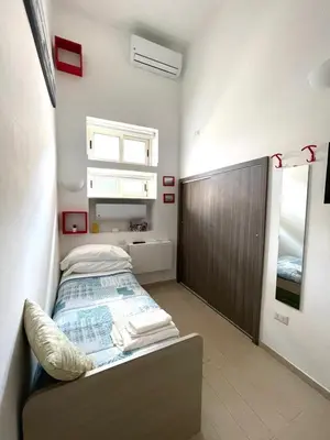 Letto o letti in una camera di Ginevra’s Apartment