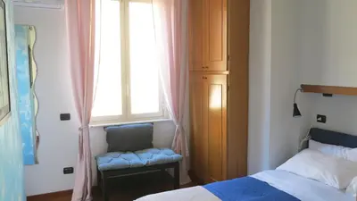Letto o letti in una camera di San Domenico Apartment (in the heart of historic centre)