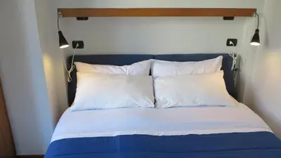 Letto o letti in una camera di San Domenico Apartment (in the heart of historic centre)
