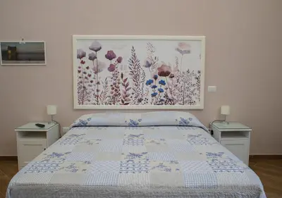 Letto o letti in una camera di B&B Galleria Principe di Napoli