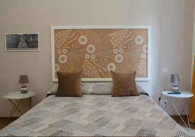 Letto o letti in una camera di B&B Galleria Principe di Napoli