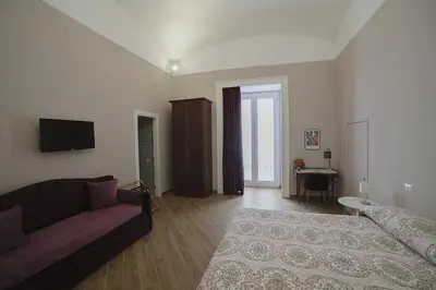 Letto o letti in una camera di B&B Galleria Principe di Napoli