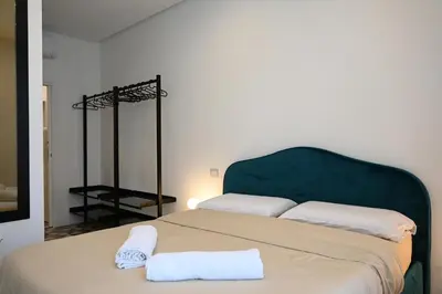 Letto o letti in una camera di QHouse