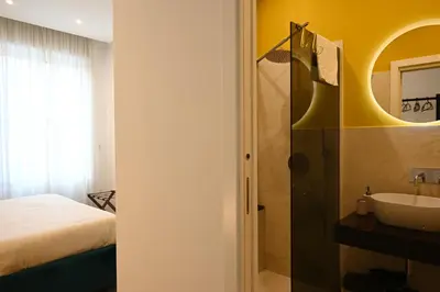Letto o letti in una camera di QHouse