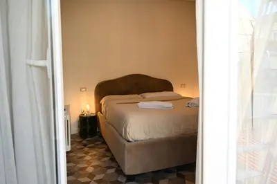 Letto o letti in una camera di QHouse