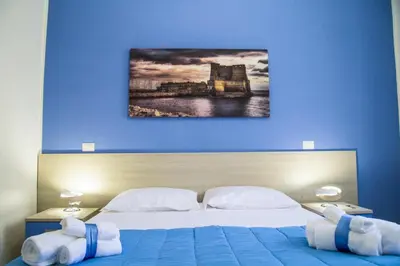 Letto o letti in una camera di Borgo Angioino