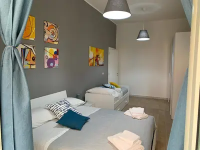 Letto o letti in una camera di la terrazza sul porto