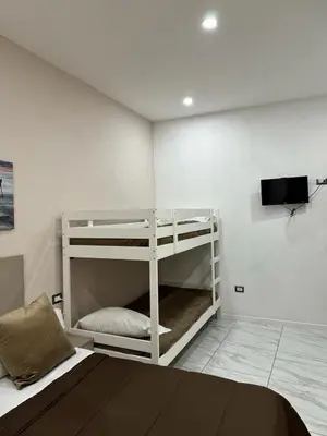 Letto o letti in una camera di Toledo Terminal Center