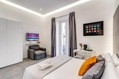 Letto o letti in una camera di Gallery Suite Naples