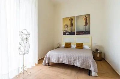 Letto o letti in una camera di La Gatta Cenerentola Rooms
