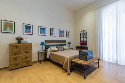 Letto o letti in una camera di La Gatta Cenerentola Rooms