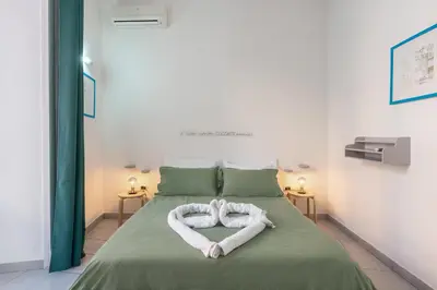 Letto o letti in una camera di Nina Suites