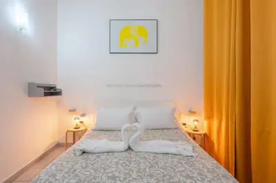 Letto o letti in una camera di Nina Suites