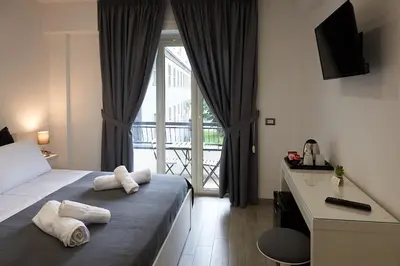 Letto o letti in una camera di Napoli Regina